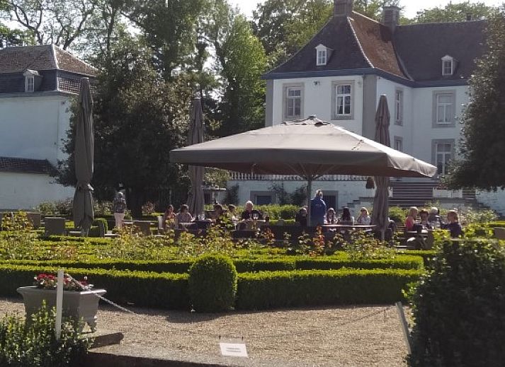 Cozy bedroom at De Lodge, a bed and breakfast in Grote-Spouwen, Limburg, overlooking the evening sky.