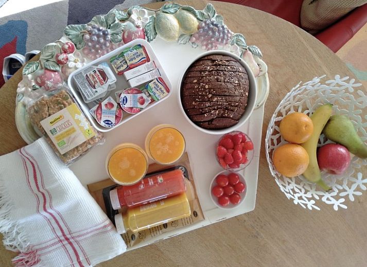 Cozy bedroom at De Lodge, a bed and breakfast in Grote-Spouwen, Limburg, overlooking the evening sky.