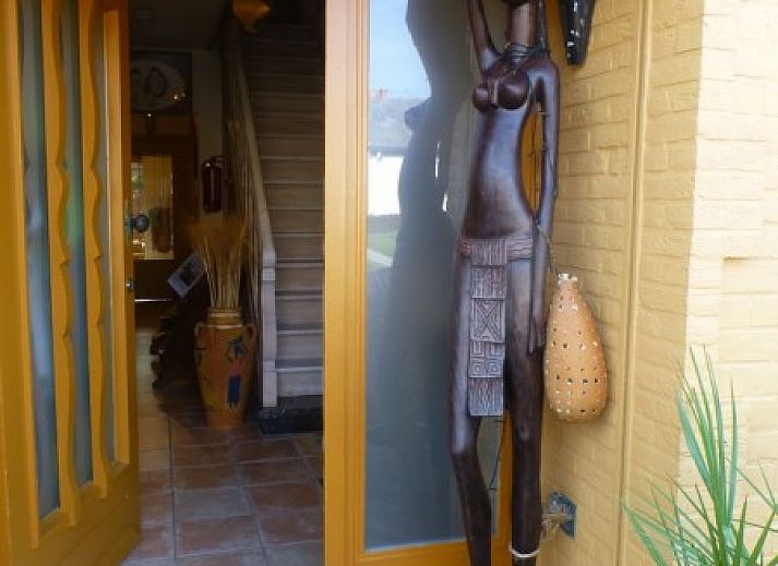 Comfortable bedroom in Charlatan bed and breakfast Knokke-Heist, Belgian coast, with warm decor.