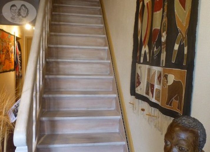 Comfortable bedroom in Charlatan bed and breakfast Knokke-Heist, Belgian coast, with warm decor.