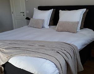 Stijlvolle slaapkamer in Valant bed and breakfast, Brugge, met knusse sfeer en moderne faciliteiten.