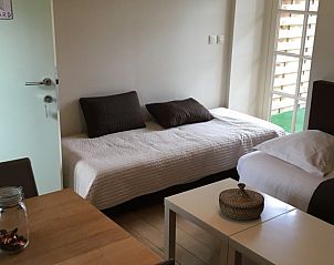 Gezellige zithoek in de kamer van B&B De Zoete Kers, Wakken, West-Vlaanderen.